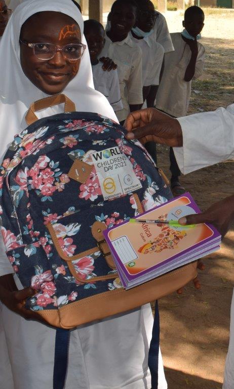 Children receive items for World Children's Day